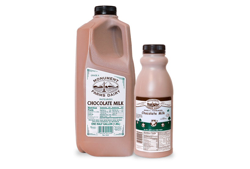 A pint and half gallon of Monument Farms whole local chocolate milk.