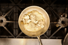 Chicken and mushrooms are added to seared chicken. Step three in the Champagne Chicken recipe shared by the chefs at Fire and Ice Restaurant as one of their local Vermont recipes made with Monument fresh local heavy cream.