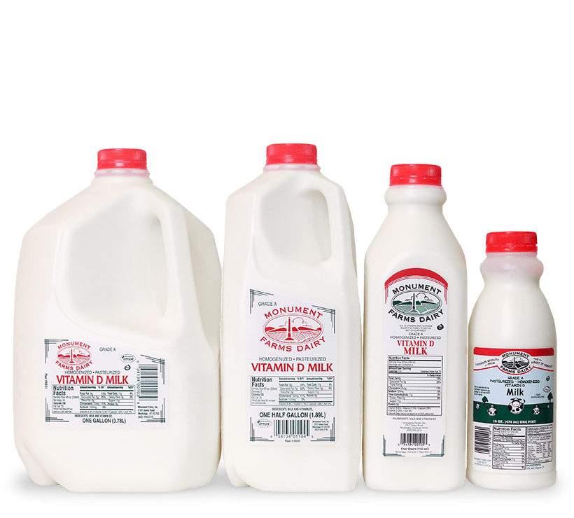 A pint, quart, half gallon, and gallon jug of Monument Farms local whole milk.