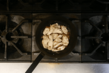 Roasted chicken and bacon lardons simmering on the stove. Step one in the Cavatappi Carbonara recipe shared by the chefs at Leunig's Bistro as one of their local Vermont recipes made with Monument fresh local heavy cream.